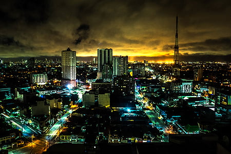 aerial photo of high rise buildings during nighttime thumbnail