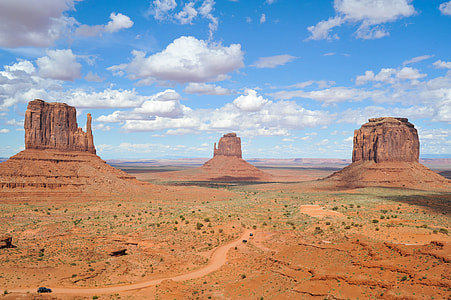 rock formation under cloudy blue sky thumbnail