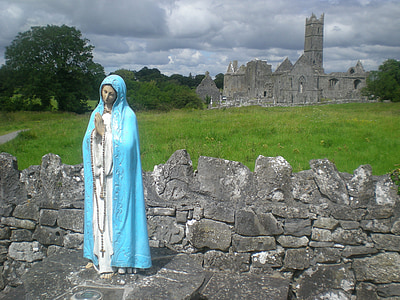 Virgin Mary statue near gray concrete building thumbnail