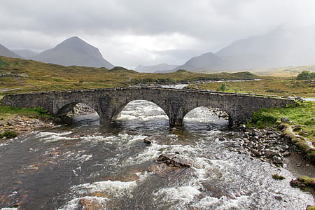 birds eye photography of bridge near mountain thumbnail
