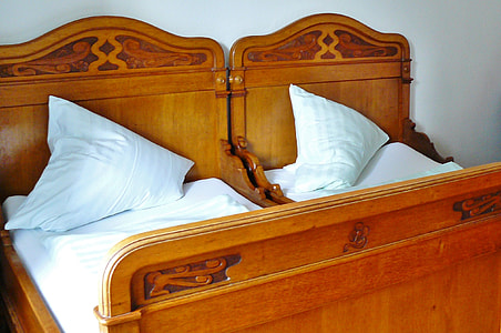 two toddler's brown wooden bed frames thumbnail