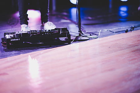 person stepping on black effect pedals thumbnail