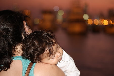 woman carrying baby thumbnail