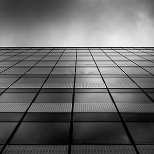 greyscale low-angle photography of building thumbnail