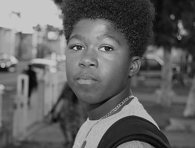 grayscale photograph of boy thumbnail