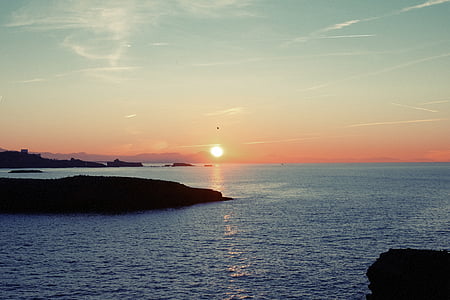 body of water during golden hour thumbnail
