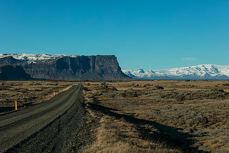 mountains covered with snow under blue sky thumbnail
