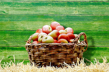 basket full of apples near wall thumbnail