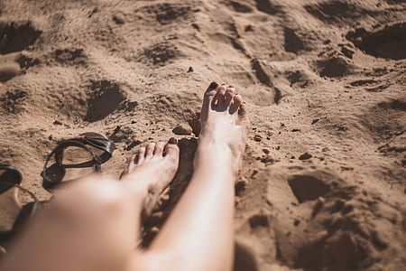 person sitting on brown sand thumbnail