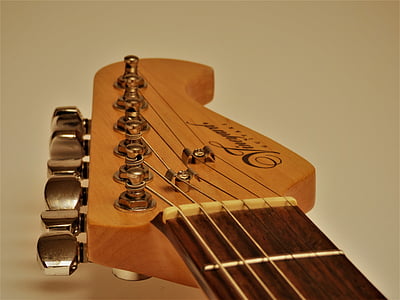 close-up photo of brown guitar headstock thumbnail