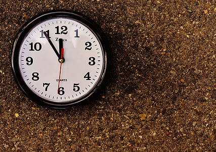 round black and white analog wall clock at 11:55 thumbnail