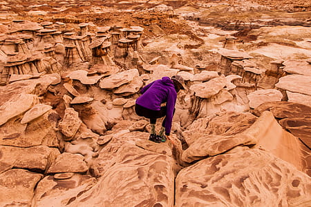 Person Taking Photo of Woman in Purple Sweater thumbnail
