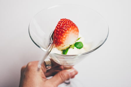 person holding drinking glass with strawberry pastry thumbnail