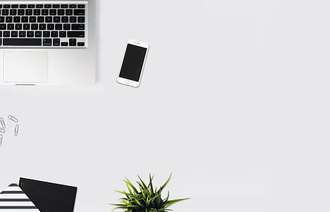 White Smartphone Beside Silver Laptop Computer thumbnail