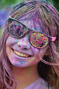 woman with assorted color paints on face thumbnail