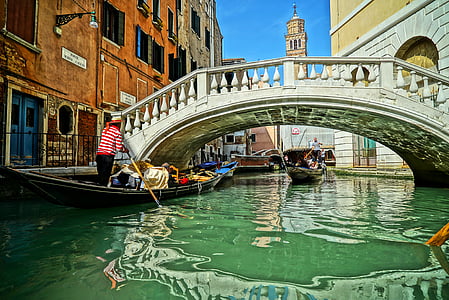 two canoe sailing under white footbridge during daytime thumbnail