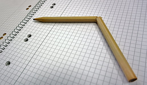 broken yellow pencil on white graphing paper thumbnail