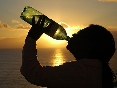 silhouette of person drinking on bottle thumbnail