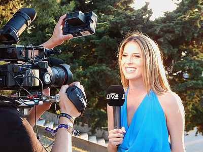 woman smiling while holding a microphone thumbnail