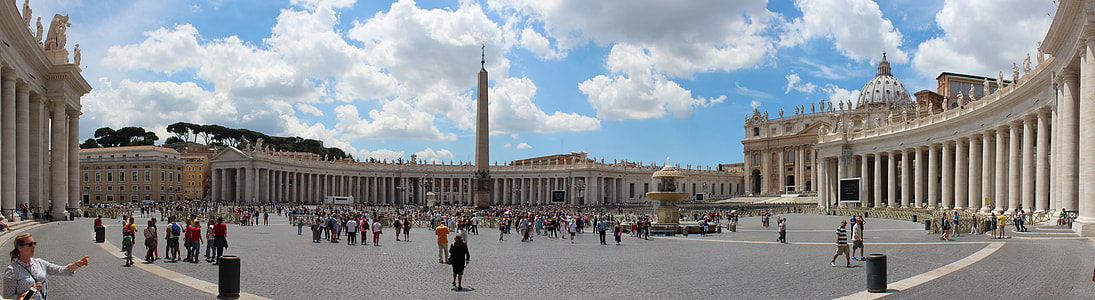 Panoramic photography of people gathering near brown painted building during daytime thumbnail