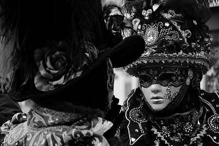 grayscale photography of two persons wearing masquerade masks thumbnail