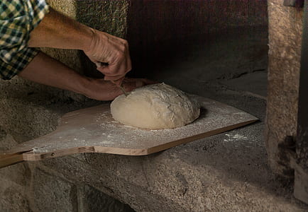 person standing near dough thumbnail