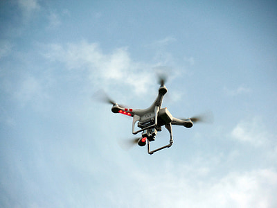 white DJI Phantom 3 Standard flying in the air thumbnail