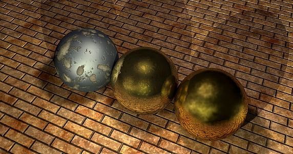 three gray and green balls on brown concrete brick wall thumbnail