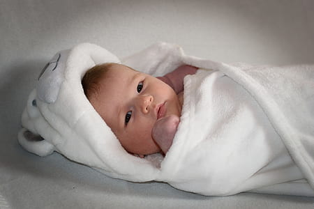 baby with white blanket thumbnail