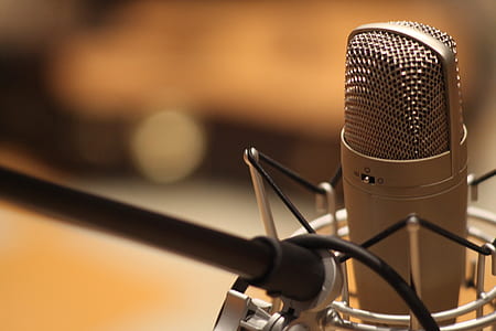 selective focus photography of silver condenser microphone thumbnail
