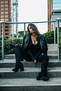 woman in black shirt sitting on stairs thumbnail