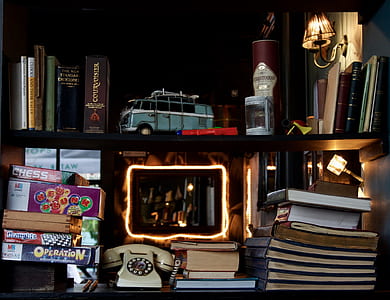 white telephone beside books thumbnail
