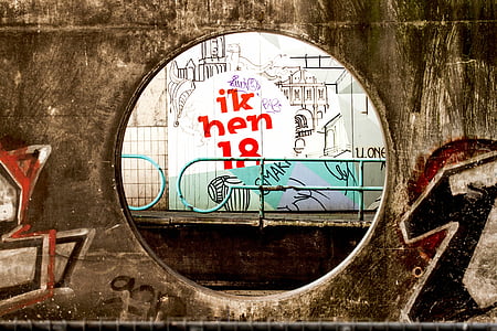 train railway with railings and graffiti wall thumbnail