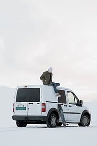 man on top of the white van thumbnail