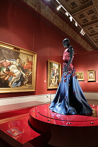 women's pink and blue gown near painting thumbnail