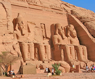 group of people standing near statues thumbnail