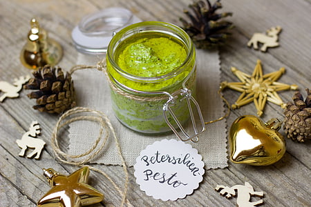 clear glass jar with petersilica paste and pine cones thumbnail