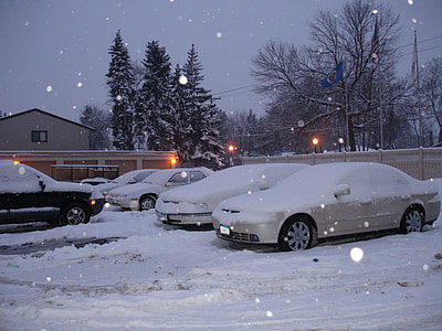 vehicles park near house coated with snow thumbnail