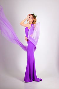 woman wearing purple sleeveless dress thumbnail