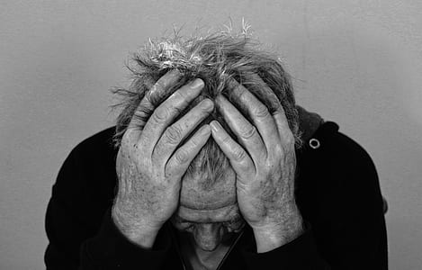 grayscale photograph of man in black top thumbnail