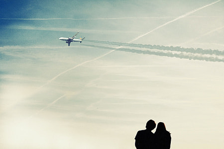 photo of couple watching airplane thumbnail
