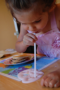girl using white plastic straw thumbnail