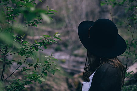 person in black sunhat thumbnail