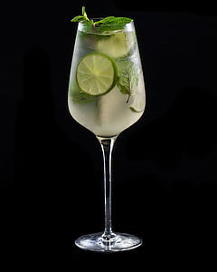 glass of beverage with lime on black surface thumbnail
