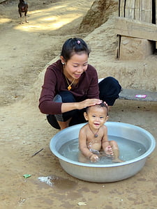 baby taking a bath on basin thumbnail