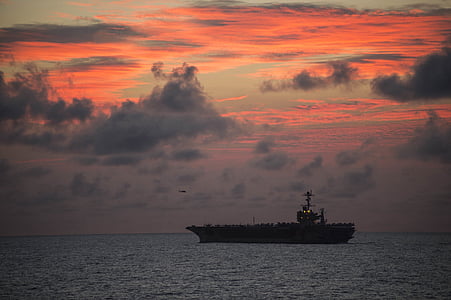 silhouette photo of boat during golden hour thumbnail