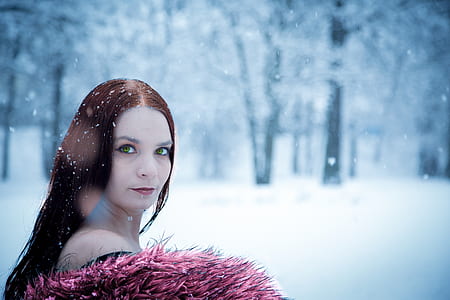 selective focus photography of woman during snow thumbnail