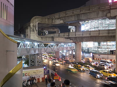 top view of cars under highway under dark skyu thumbnail