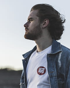Man Wearing White Crew-neck Vans Top and Blue Denim Button-up Jacket thumbnail