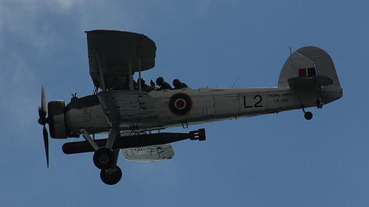 white bomber plane in the air thumbnail